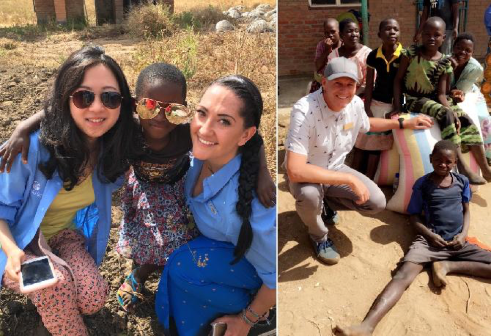 Nu Skin sales leaders and employees pose for a picture with Malawi children.